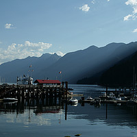 Buy canvas prints of Mountains and sunlight, Horseshoe Bay ferry port,  by Sophie Shoults