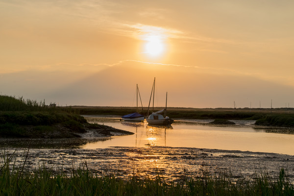 sunset over Brancaster Staithe Picture Board by Dorringtons Adventures