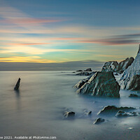 Buy canvas prints of Breathtaking Sunset over Rocky Seascapes by Ian Stone