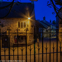 Buy canvas prints of Lamplight in Stow on the Wold  by Ian Stone