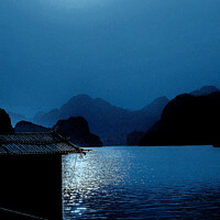 Buy canvas prints of Enchanting Blue Moon over Ha Long Bay by Ian Stone