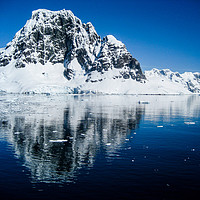 Buy canvas prints of Antarctic mountain reflections by Rosaline Napier