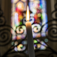 Buy canvas prints of Candle and stained glass window by Rosaline Napier