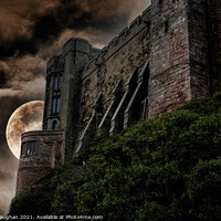 Buy canvas prints of Majestic Bamburgh Castle Overlooking Moonlit Beach by Kevin Maughan