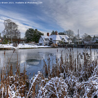 Buy canvas prints of Village Pool, Badger with cottage in winters Snow by Philip Brown