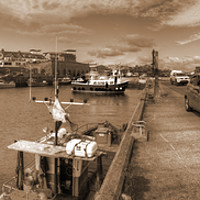 Buy canvas prints of Fishing Boats at Seahouses Harbour - Sepia Version by Philip Brown