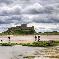 Buy canvas prints of Storm clouds over Bamburgh Castle - Panororama by Philip Brown