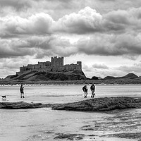 Buy canvas prints of Storm clouds over Bamburgh Castle - Panororama by Philip Brown