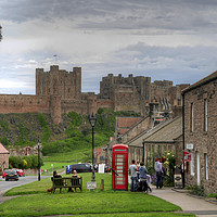 Buy canvas prints of Bamburgh Village and Castle - Colour by Philip Brown