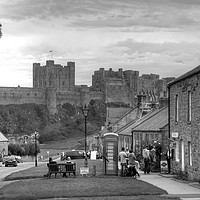 Buy canvas prints of Bamburgh Village and Castle - Black & White by Philip Brown
