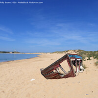Buy canvas prints of Cape Trafalgar Beach and Lighthouse Near Cadiz, Spain by Philip Brown