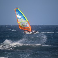 Buy canvas prints of Windsurfer jumping in the waves by Ines Porada