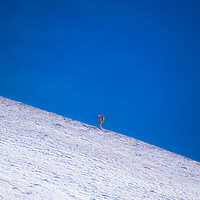 Buy canvas prints of Photographer on a Snowy Mountain by Duncan Loraine