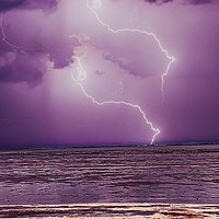 Buy canvas prints of Lightning at the beach  by Rachael Smith