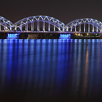 Buy canvas prints of Railway Bridge crosses the Daugava river in Riga by Andis Atvars