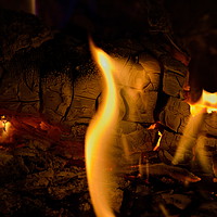 Buy canvas prints of Open flame in fireplace by Andis Atvars