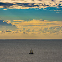Buy canvas prints of A lone sailing boat at sunrise  by Robin Lee