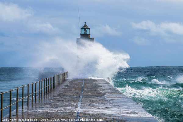 Waves crashing over St Peter Port breakwater. Picture Board by George de Putron