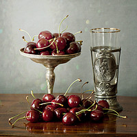 Buy canvas prints of Still life, red cherries on a silver plate and an  by Luisa Vallon Fumi