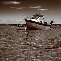 Buy canvas prints of White boat on sand in sepia by youri Mahieu