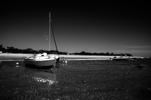 boats laying on the beach in blackwhite Picture Board by youri Mahieu