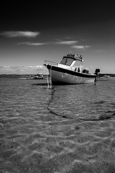 White boat on sand Picture Board by youri Mahieu