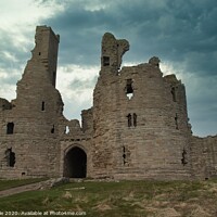 Buy canvas prints of Dunstanburgh Castle by Mike Dale