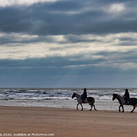 Buy canvas prints of Horseriders on a Winter Beach by Mike Dale