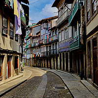 Buy canvas prints of Street Scene Guimaraes, Portugal by Roz Collins