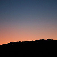 Buy canvas prints of Marvão Silhouetted against the Evening Sky by Roz Collins