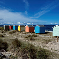 Buy canvas prints of Vibrant Findhorn Beach Huts by Tom McPherson