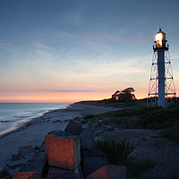 Buy canvas prints of Pape's lighthouse in calm sunset by Dalius Baranauskas
