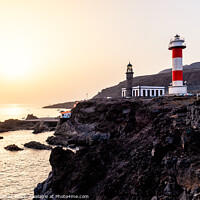 Buy canvas prints of Sunset on the volcanic coast at Fuencaliente Lighthouse in La Palma by Juan Jimenez