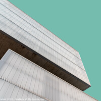 Buy canvas prints of Low angle view of modern architecture glass facade against sky by Juan Jimenez