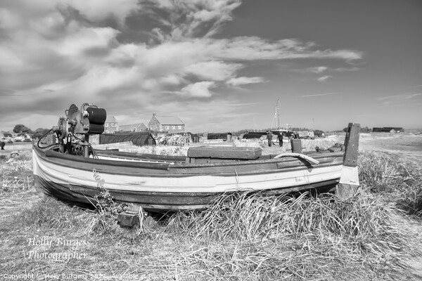 Holy island, boat in the sand on the beach in black and white  Picture Board by Holly Burgess
