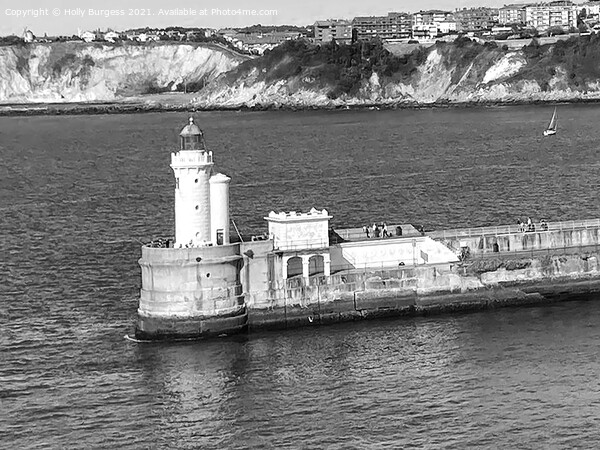 Getxo, bay of Biscay a lighthouse on the edge of the harbour, a look out for the military base that is still there after many years from the war Picture Board by Holly Burgess