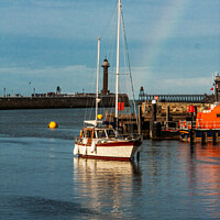 Buy canvas prints of Rainbow's Embrace over Whitby Harbour by Holly Burgess