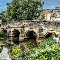 Buy canvas prints of Bradford on Avon Bridge with reflections in the water  by Holly Burgess