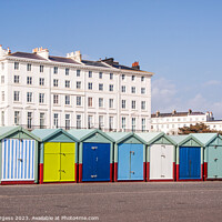 Buy canvas prints of Brighton's Vibrant Waterfront: Chalets and Sea Vie by Holly Burgess