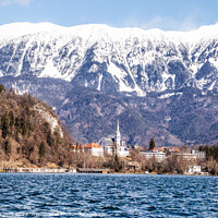 Buy canvas prints of Serene Lake Bled's Historic Church Illuminated by Holly Burgess