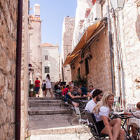 Buy canvas prints of Enjoying life outside in Dubrovnik Croatia  by Holly Burgess