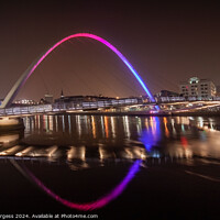 Buy canvas prints of Millennium Bridge lit up at night Newcastle Quay side  by Holly Burgess
