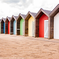 Buy canvas prints of Vibrant Beach Huts, Blyth Northumberland by Holly Burgess