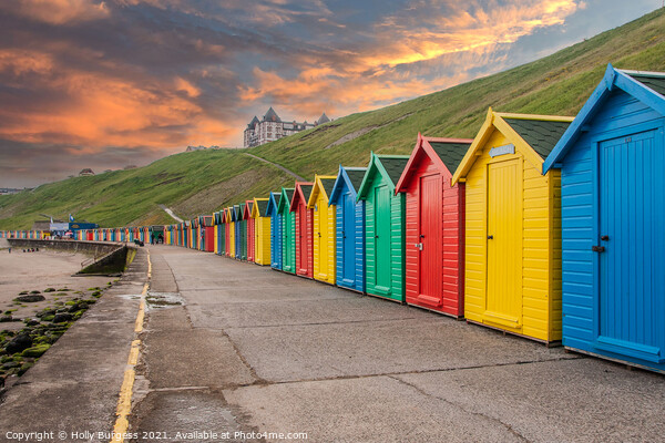 Whitby's Colourful Beach Huts at Sunset Picture Board by Holly Burgess