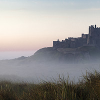 Buy canvas prints of Bamburgh castle at dawn by Brian Pain