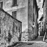Buy canvas prints of Crossing of alleys in alpine village, BW by Claudio Lepri