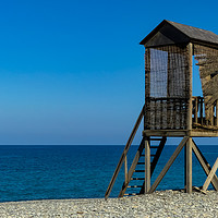 Buy canvas prints of A rustic wooden lifeguard's hut on a shingle beach by Stephen Robinson