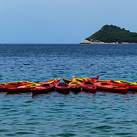 Buy canvas prints of Red and yellow kayaks in Lopud Bay, Croatia by Stephen Robinson