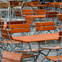 Buy canvas prints of Unoccupied chairs and tables in a garden restaurant  by Frank Heinz