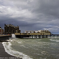 Buy canvas prints of Aberystwyth Victorian pier on a stormy day by Jenny Hibbert